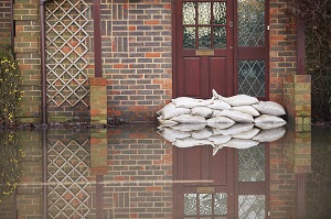 sandbags next to a door during a flood
