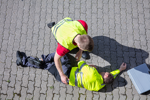 an injured worker being assisted